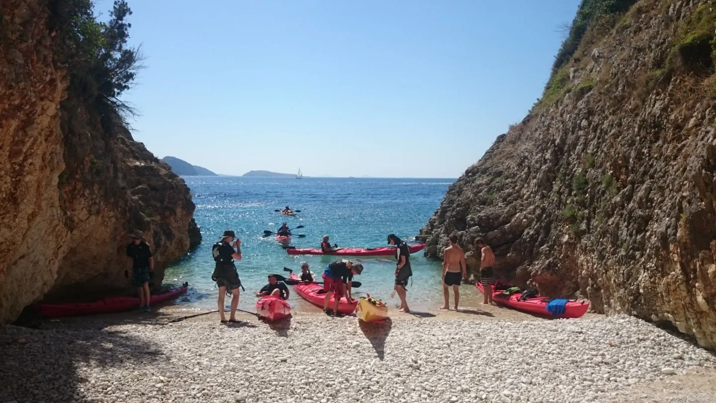 Sea Kayaking coming to shore beach Greece